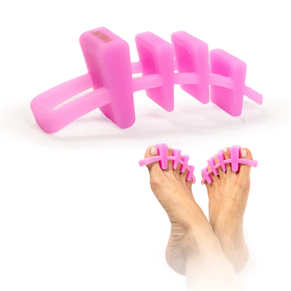 Pink Tuli's Soft Moves Toe Separators displayed on white background and worn on feet for stylish foot therapy.